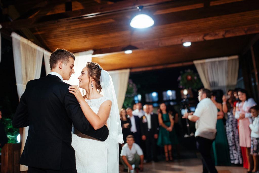 Happy bride and groom a their first dance, wedding in the elegant restaurant with a wonderful light and atmosphere