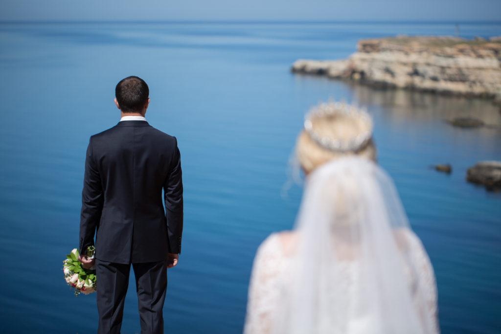 meeting of the bride and groom on a cliff
